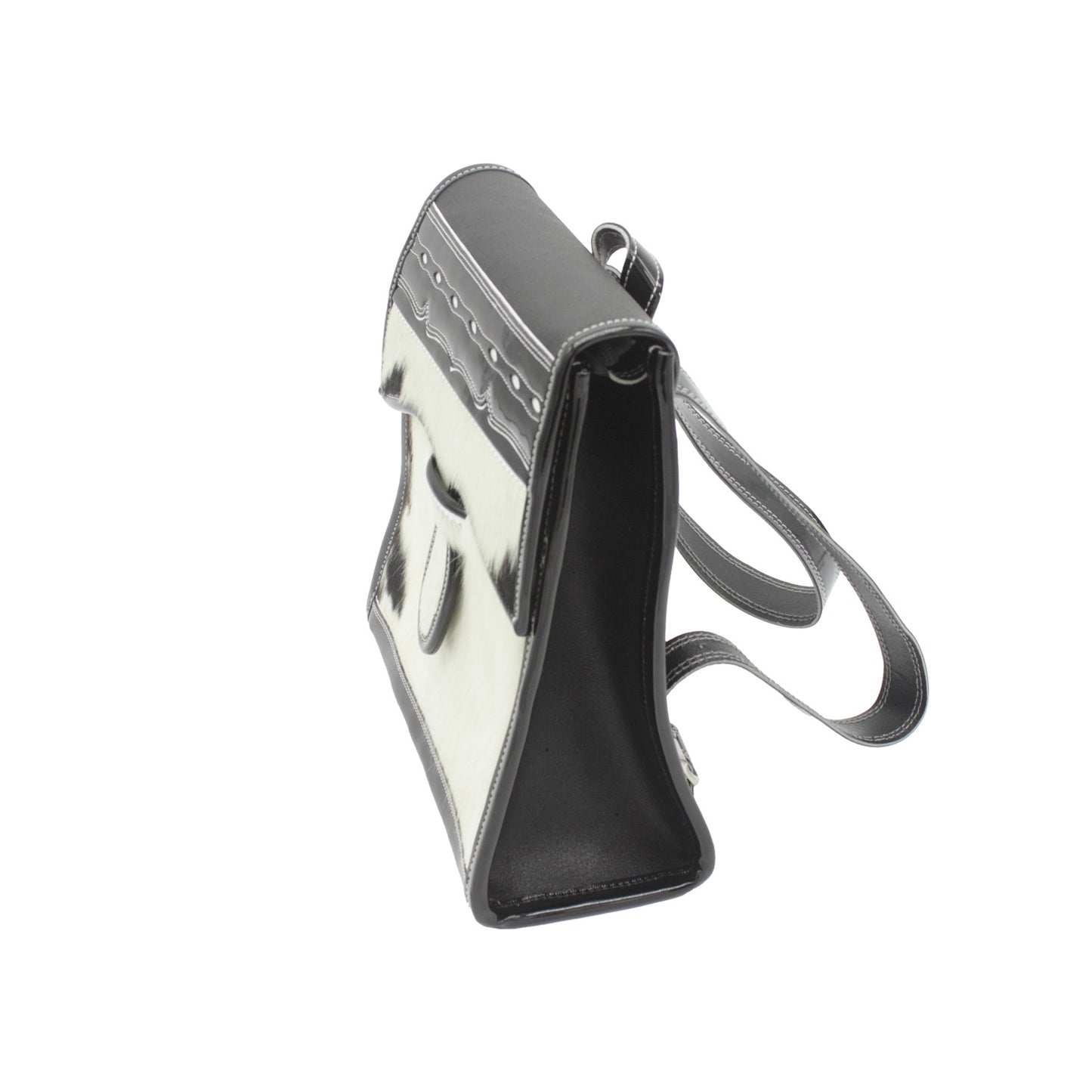 black and white leather cowhide handbag with a strap on a white background